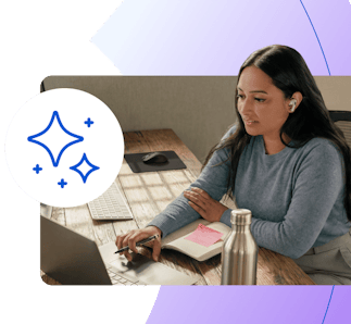 woman on laptop with earbuds