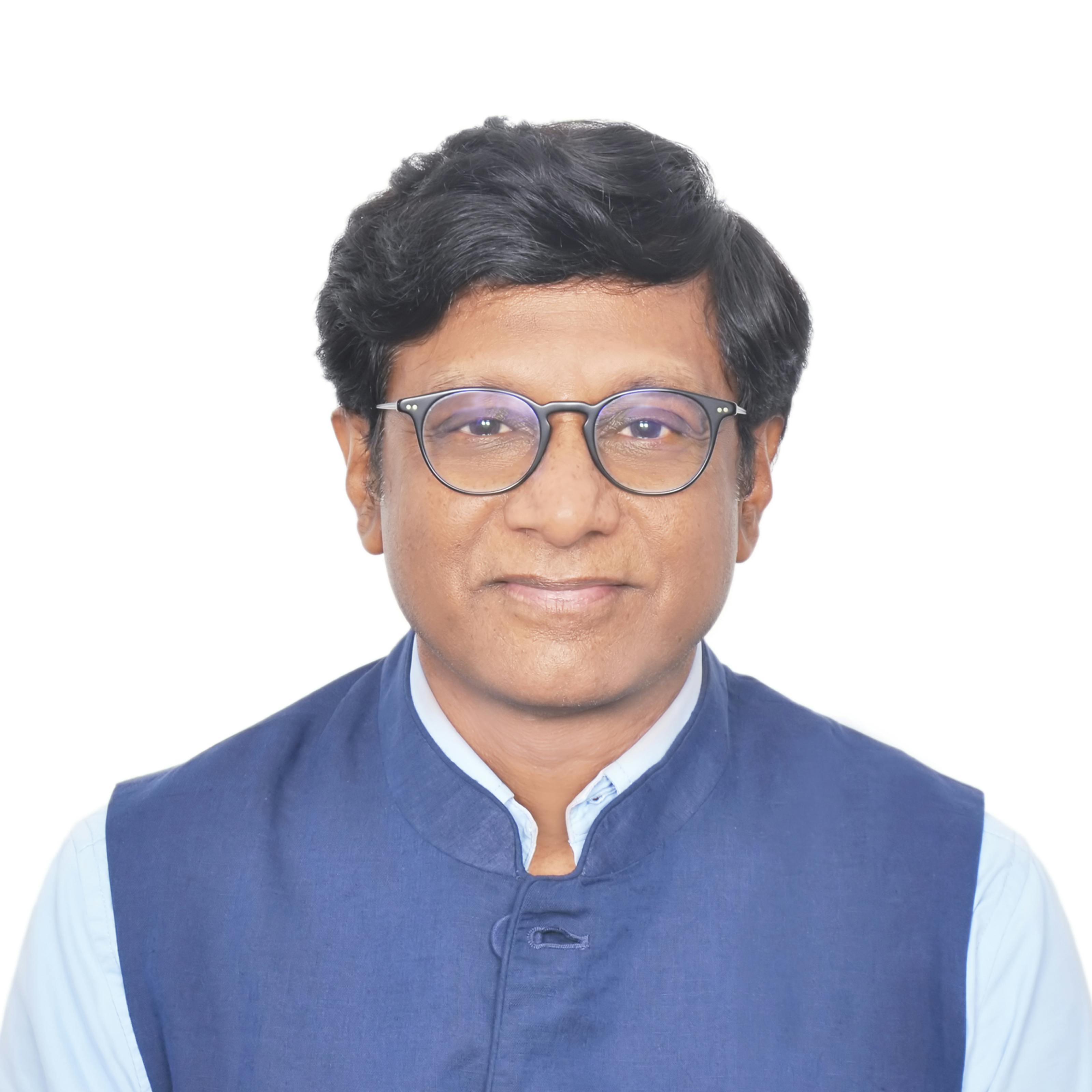 Former Ambassador / Dr. Mohan Kumar