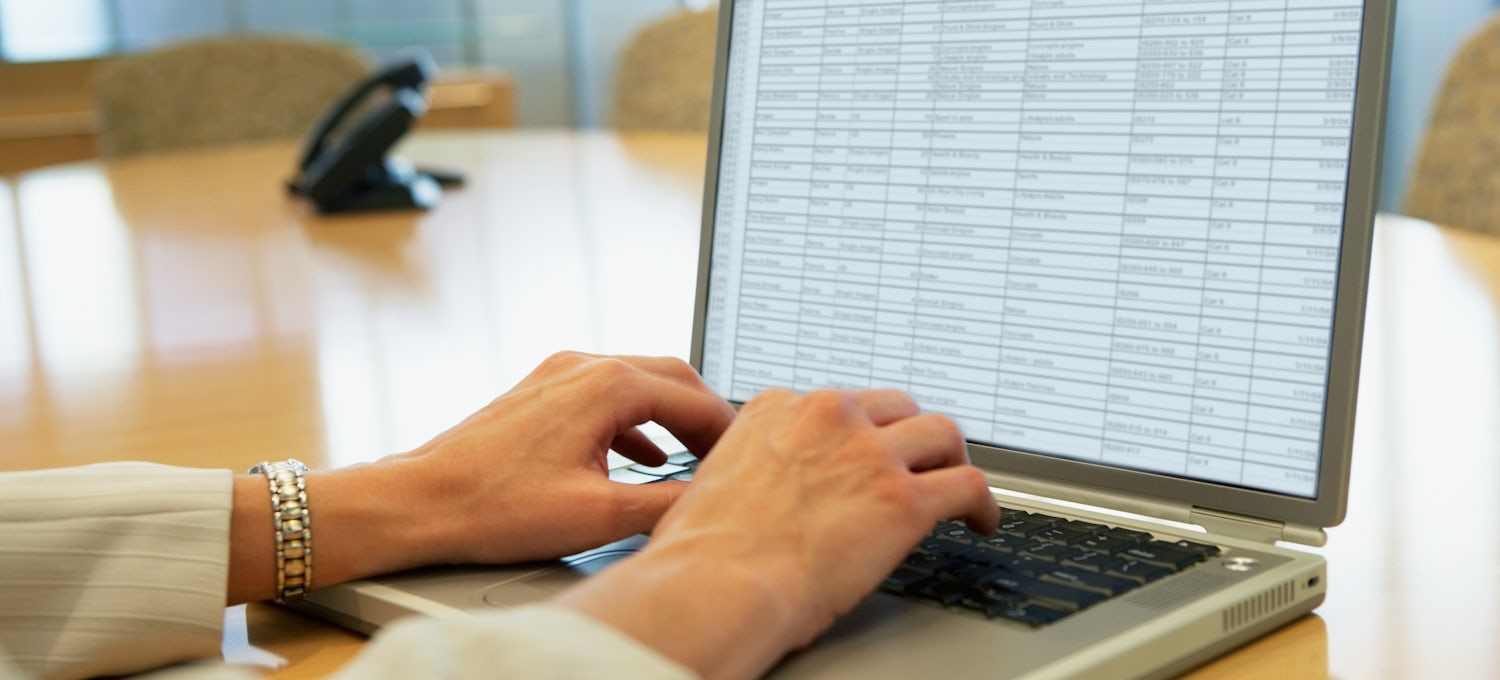[Featured image] A person works with structured data in a spreadsheet on a laptop computer.