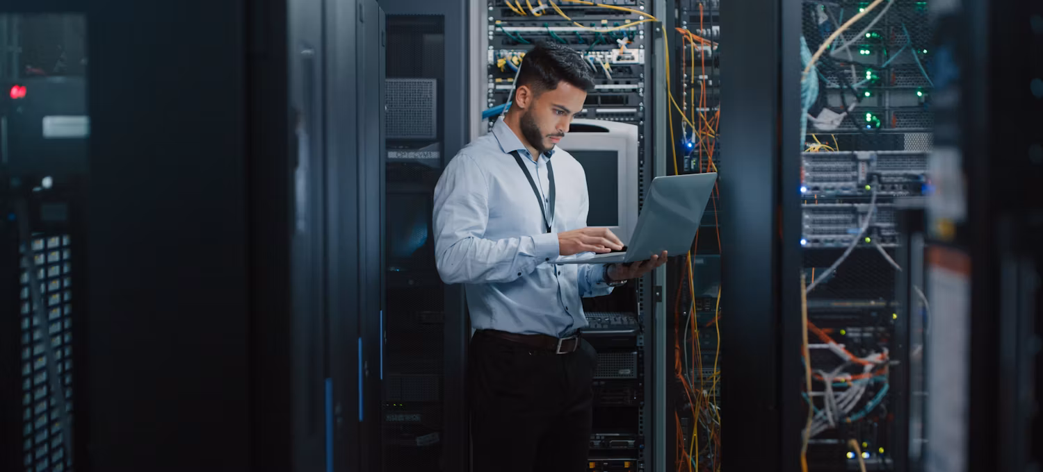 [Featured Image} A man working in information technology is looking at the closeness centrality in the company's network.