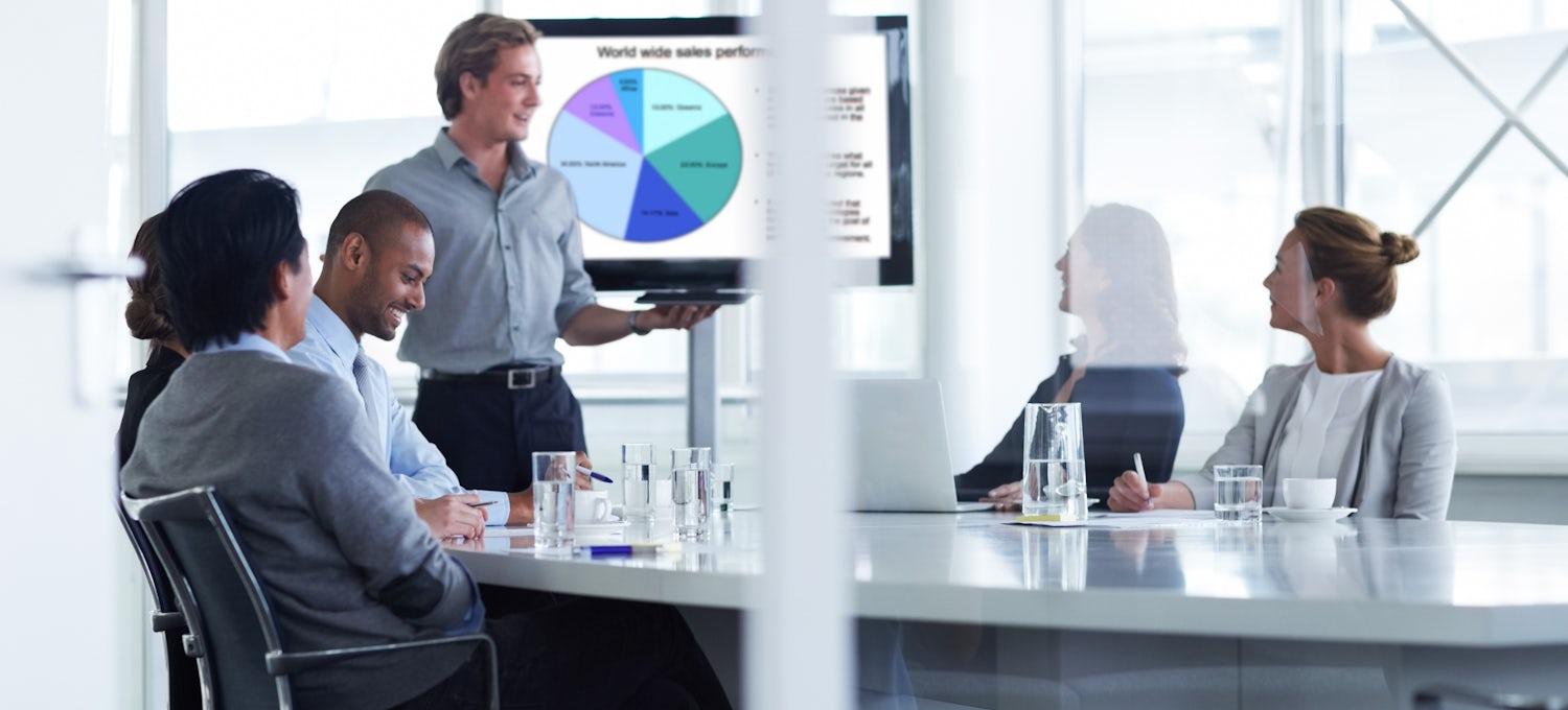 [Featured image] Sales manager gives a presentation to a sales team