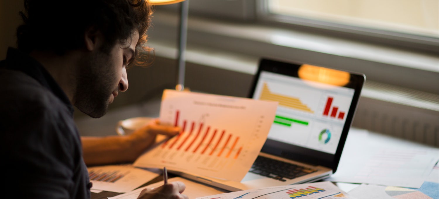 A student working on marketing graph statistics concept.