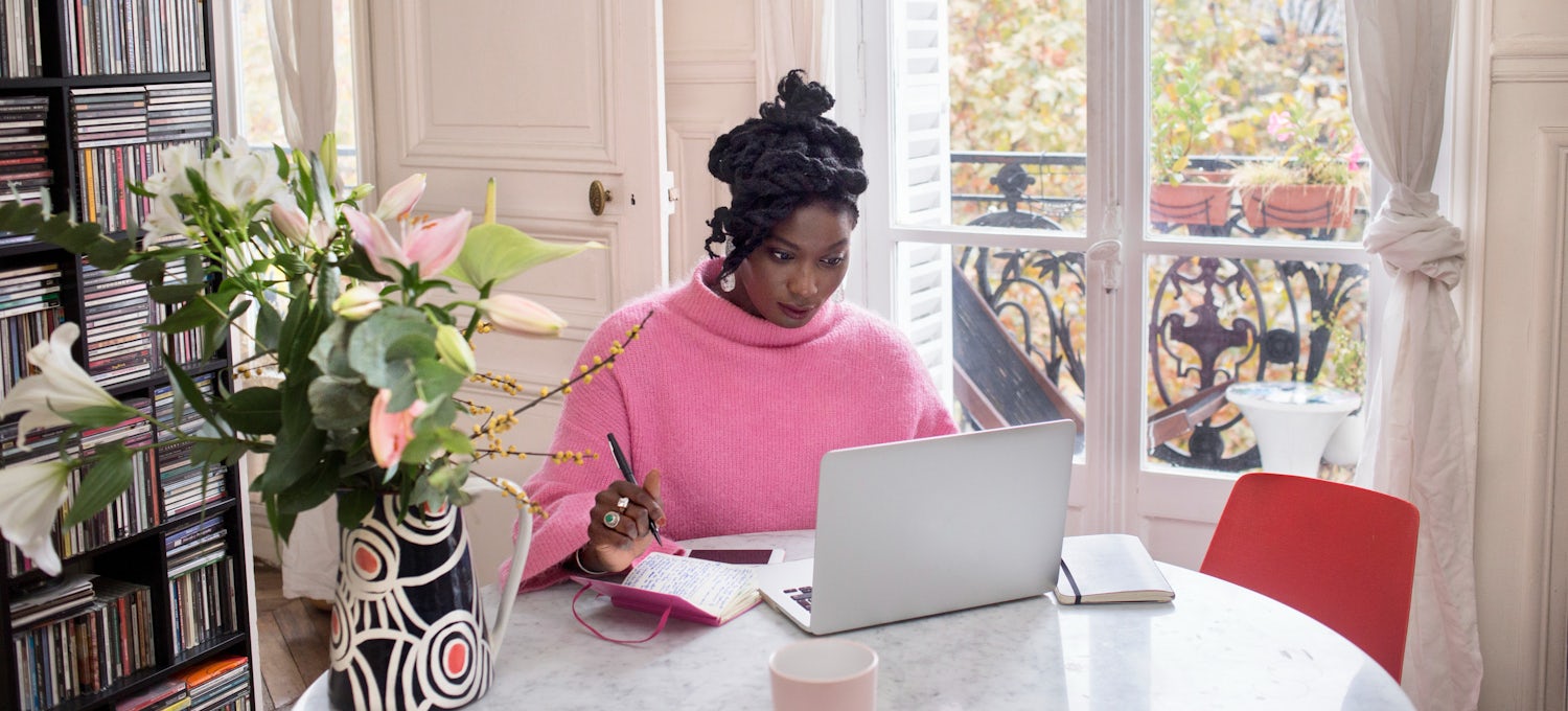 A woman studying an online degree