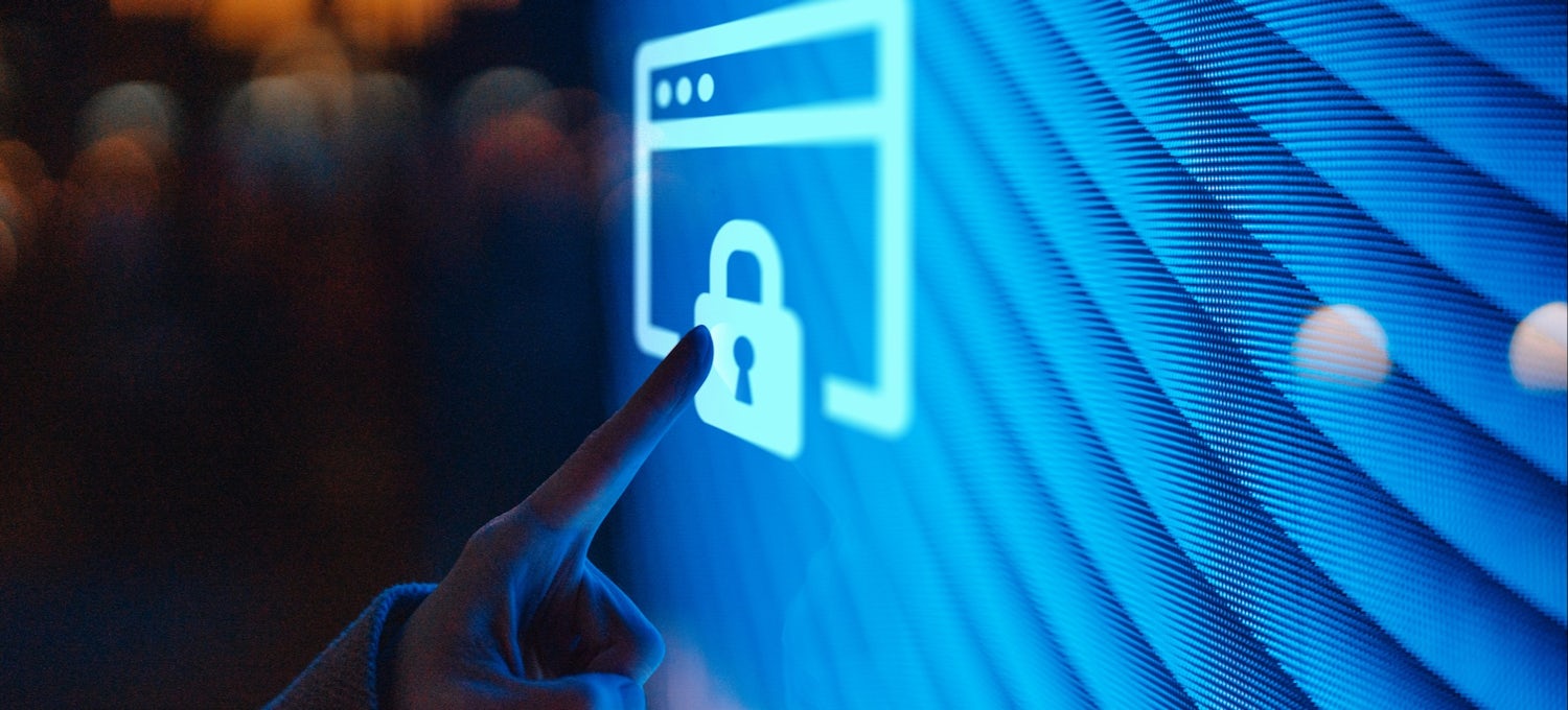 [Featured image] A person's index finger is touching a digital screen that has an image of a lock and square. 