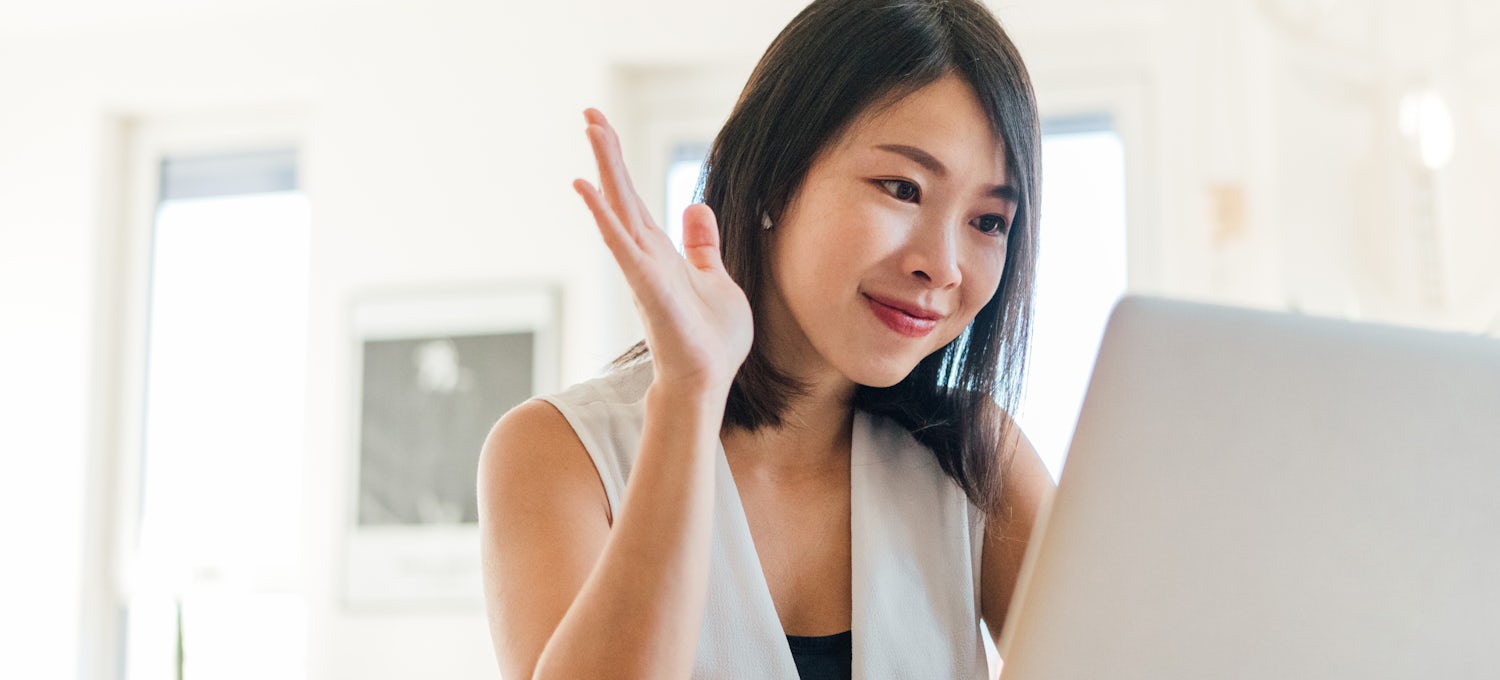 [Featured image] A young woman sits at a laptop and participates in a video chat with a mentor explaining how to become a data analyst without a degree.
